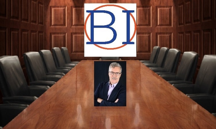 A picture of a board room with a man in the middle